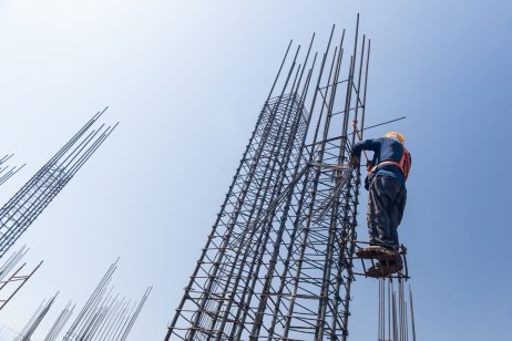A worker strengthening steel rebar for a building structure