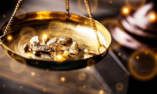 Gold nuggets on a balance