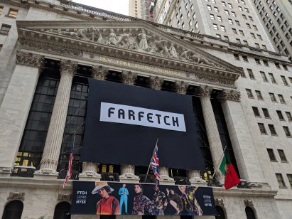 New York City - September 21, 2018: Banner on the New York Stock Exchange building celebrating the IPO of the on line fashion house Farfetch in Lower Manhattan.