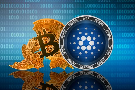 Cardano coin stands in front of cracked bitcoin token, blue background with code. 