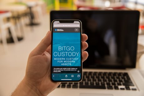 A smartphone displays the BitGo name