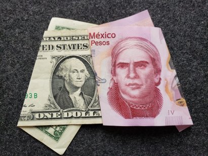 american banknote of one dollar and mexican banknote of fifty pesos