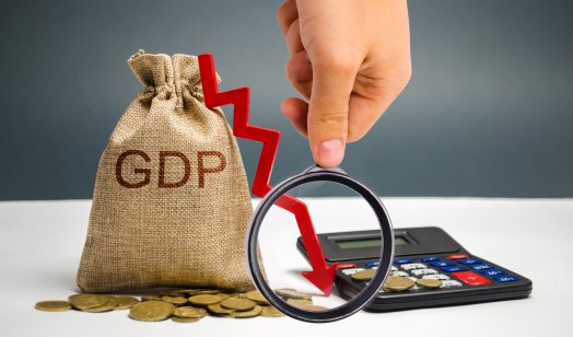 A picture of a money bag with the word GDP and down arrow