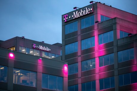 Bellevue, Washington / USA - January 3 2019: Tiered exterior of the T Mobile headquarters building at night, with exterior magenta lights, and space for text on the bottom