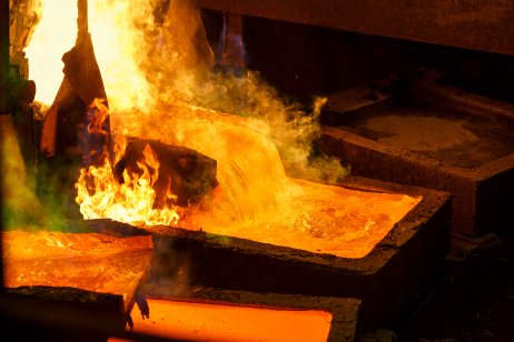 Molten metal is poured at a factory