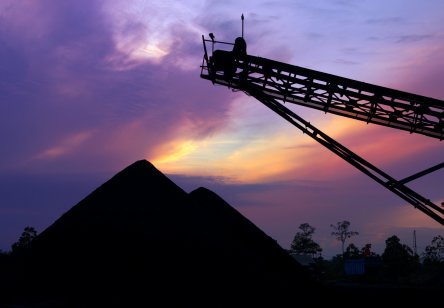 Coal pile stock at sunset