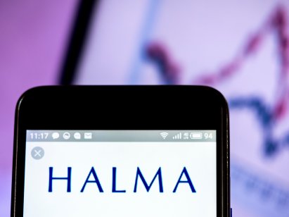 The blue Halma logo shown on a smartphone
