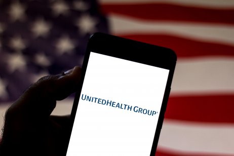UnitedHealth (UNH) stock forecast. In this photo illustration the UnitedHealth Group logo is displayed on a smartphone.