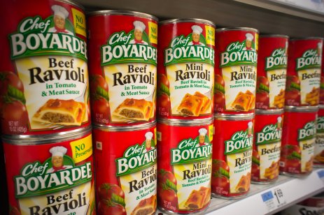 A supermarket shelf showing a range of tins of various Conagra brand products