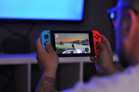 A man playing Zelda on Nintendo Switch.