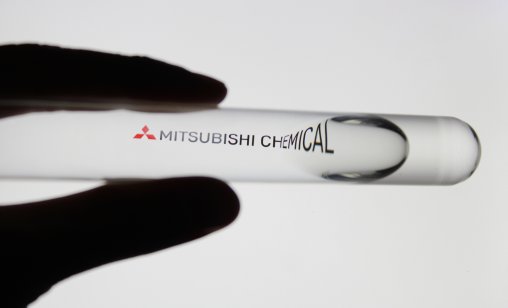 Logo of Mitsubishi Chemical through a test tube