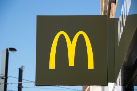 Croydon, London, UK - CIRCA OCT 2019: A McDonald's golden arch symbol as store board in London with blue sky background