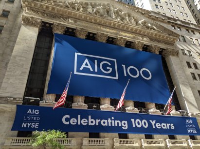 A image of the AIG sign outside of the New York Stock Exchange