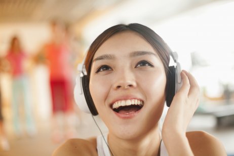 Person listening to music using headphones