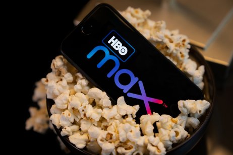 smartphone with HBO Max logo in tub of popcorn