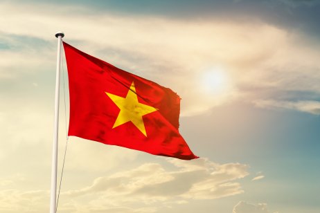 Vietnam national flag cloth fabric waving on the sky with beautiful sun light - Image