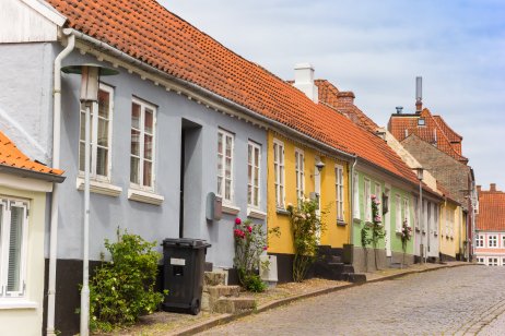 Colorful historic houses in a cobblestoned street of Haderslev, Denmark