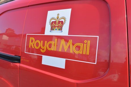 Royal Mail share-price forecast: Is there any upside ahead? A royal mail sign on the side of a red delivery van