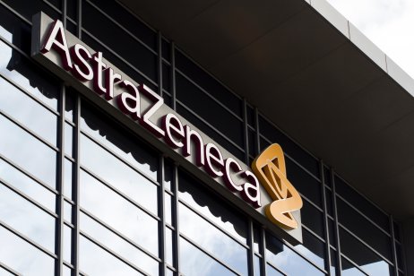 An AstraZeneca sign on a glass-fronted building 
