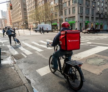 DoorDash courier on a bicycle