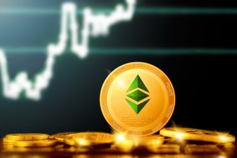 Gold ethereum coin on the background of a chart
