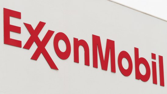 ExxonMobil logo seen on white billboard