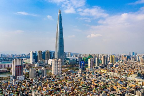 Jamsil, Songpa-gu, Seoul, South Korea - April 11, 2020: Aerial view of Lotte World Tower surrounded by houses and highrise apartments