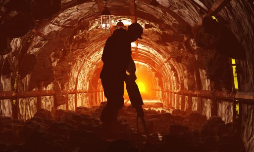 Silhouettes of workers in a mine