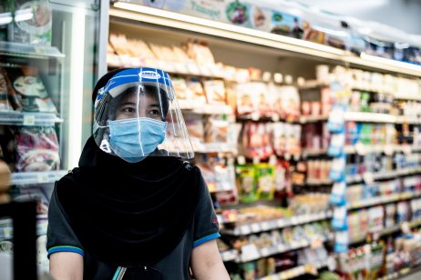 Thai store worker wearing face mask