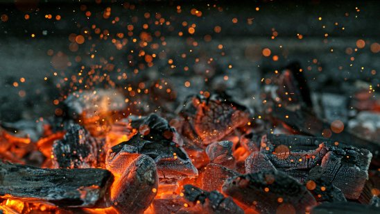 Flaming hot charcoal briquettes