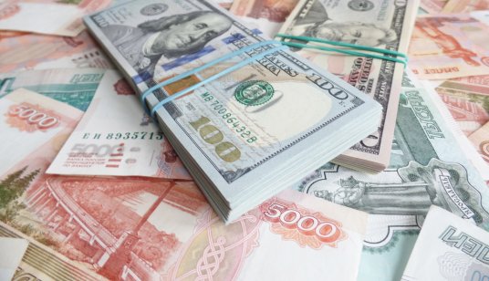 American dollars and Russian rubles on the table