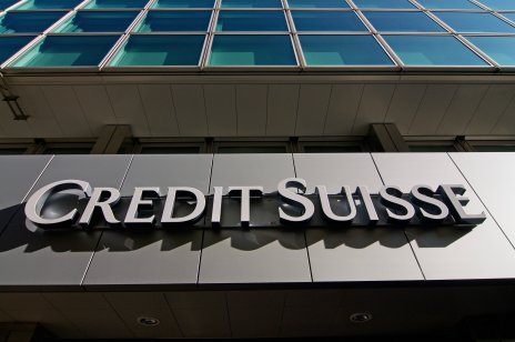Credit Suisse Bank sign hanging in front of the building in Lugano