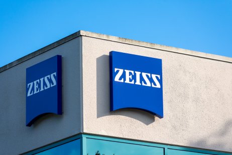 Photo of Carl Zeiss logo on building - Grey structure with blue and white Car Zeiss lettering