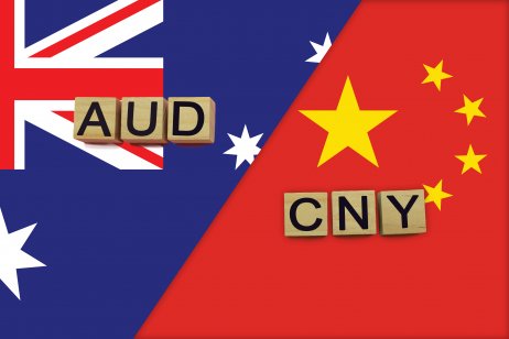 Australia and China currencies codes on national flags background.