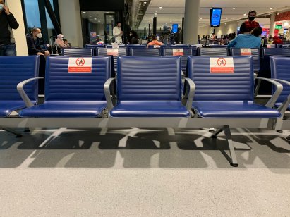 Social distancing markers on seats at the Dubai Airport