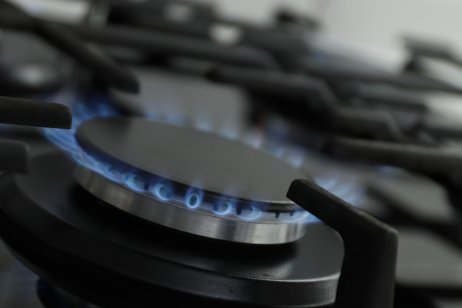 A gas stove burner on full flame