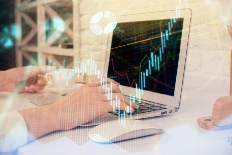 Double exposure of woman hands typing on computer and forex chart hologram drawing. Stock market analysis concept.