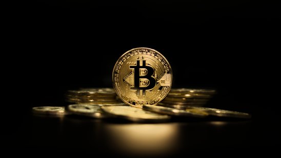 Bitcoin token highlighted on a black background