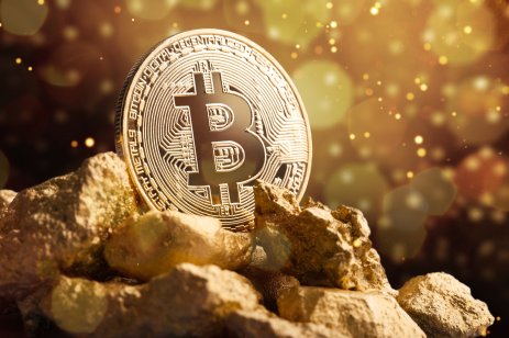 Bitcoin coin on gold
