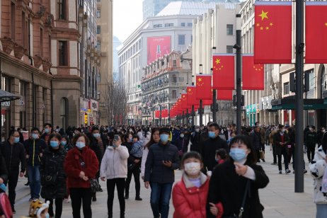 Tourists in face mask on crowded Nanjing Road, Shanghai, China 
