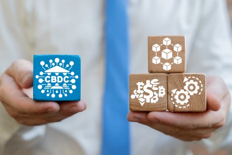 Wooden blocks illustrate link between central bank digital currencies (CBDCs) and blockchain technology