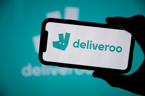 LONDON, UK - April 2021: Deliveroo takeaway delivery service logo on a phone