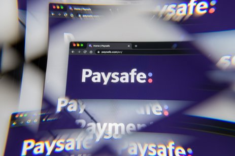 Milan, Italy - APRIL 10, 2021- Paysafe company logo on laptop screen seen through an optical prism, creative interpretation. Dynamic and unique image from Paysafe website. Illustrative editorial.