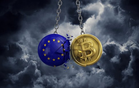 A bitcoin and a coin coloured with the EU flag clash 