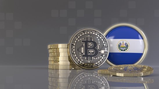  Pile of bitcoin, one embossed with El Salvador's flag