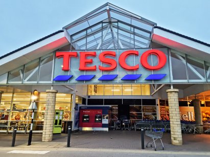 HALIFAX, UK - MAY 14, 2021: A Tesco supermarket exterior in the early morning before the shoppers arrive. A British multinational groceries retailer