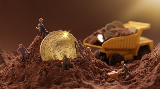 Miner figurines digging ground to uncover big Gold bitcoin. Cryptocurrency Mining concept