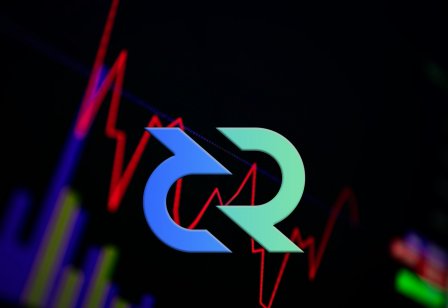 The Decred logo in front of a price chart