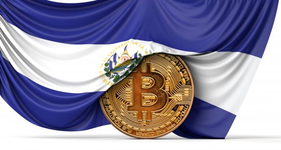 El Salvador flag draped over a bitcoin