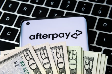 AfterPay logo behind money